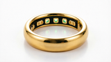 Smart ring paired with its compact magnetic charging case on a clean background